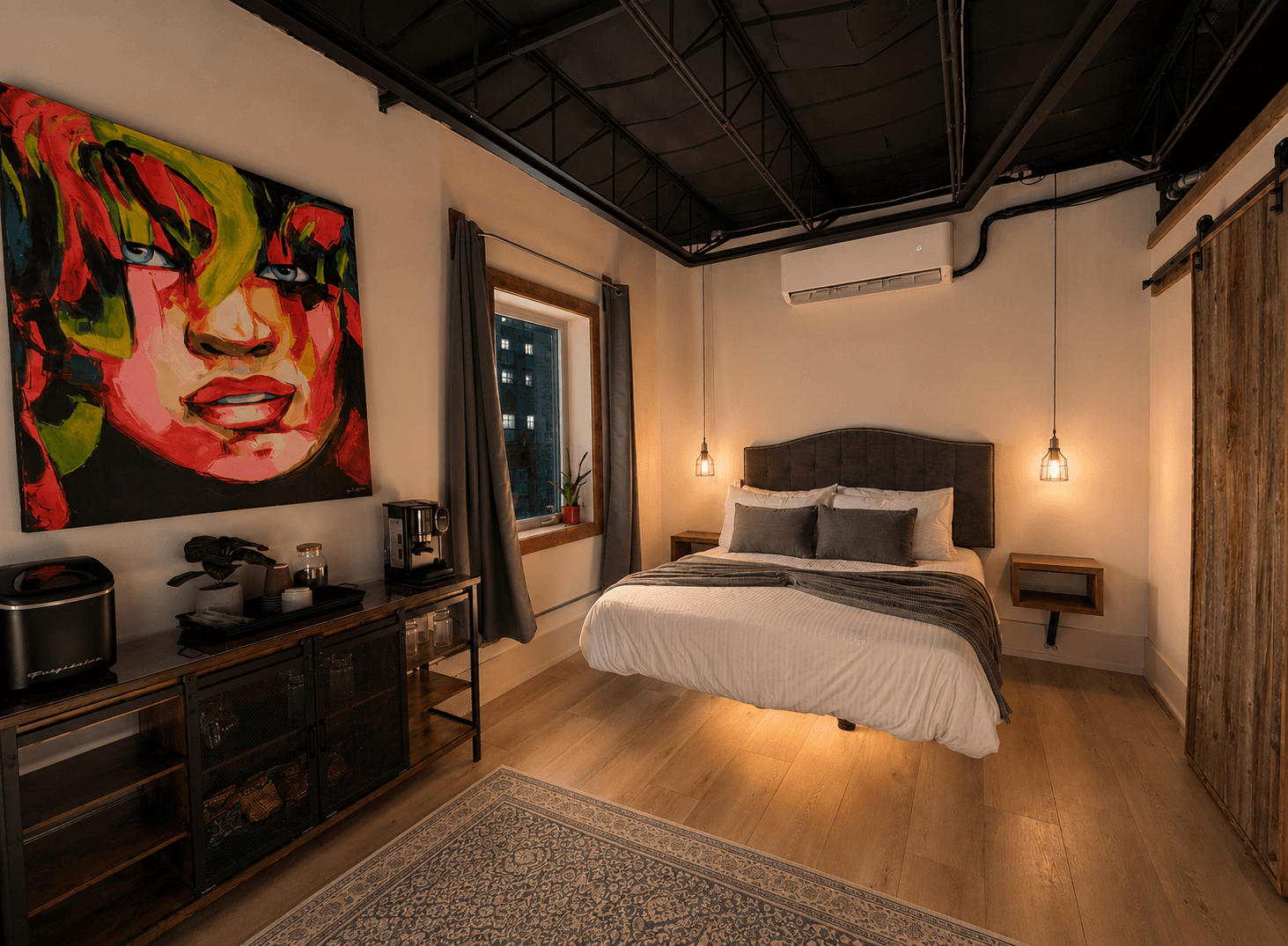 A stylish bedroom featuring a colorful wall art, a queen-sized bed, and warm lighting.
